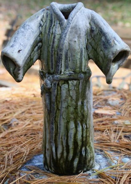 Kimono figure, Susan Kotulak, not yet freed from kiln shelf, celadon glaze, Fall 2013